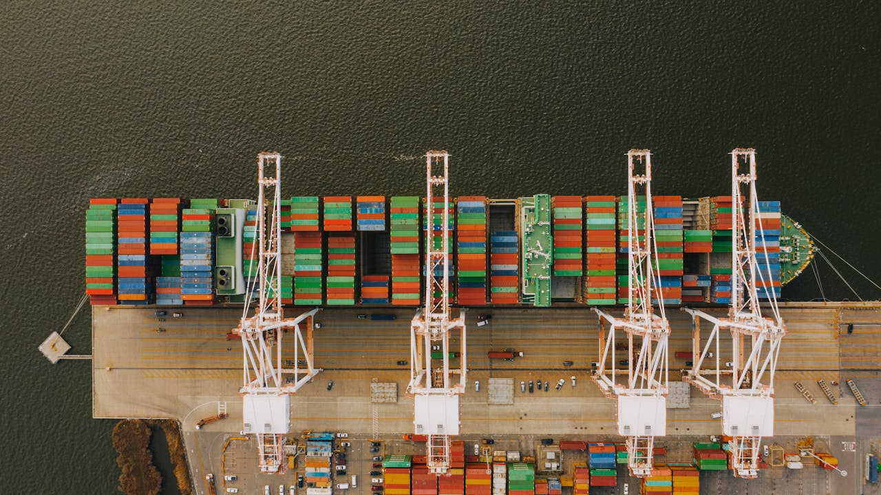 Colorful cargo containers on ship near pier